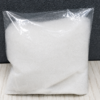 Pure off white crystalline extract powder inside a transparent plastic pouch