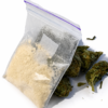 Golden crystalline powder alongside premium herbal botanicals
